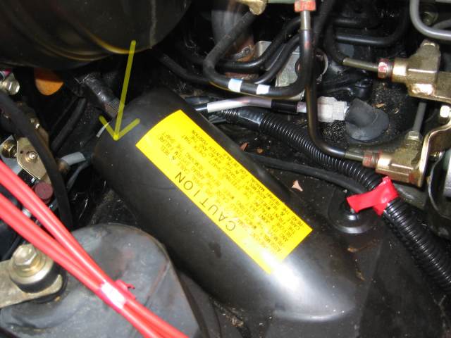 Firewall hole behind steering column