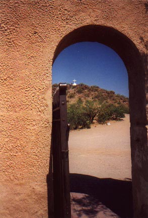 Hill view through archway at San Xavier [Yashica T4S]